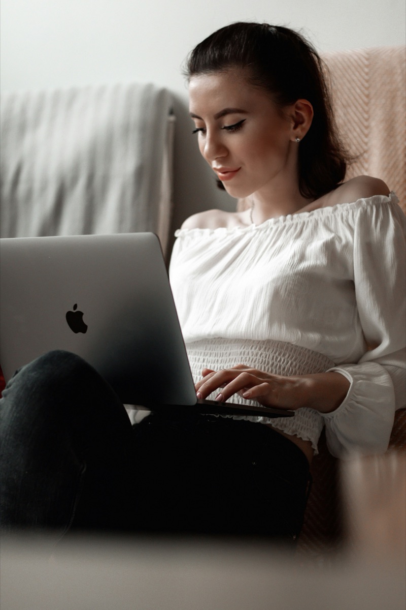 Someone at home on a laptop, joining a virtual appointment