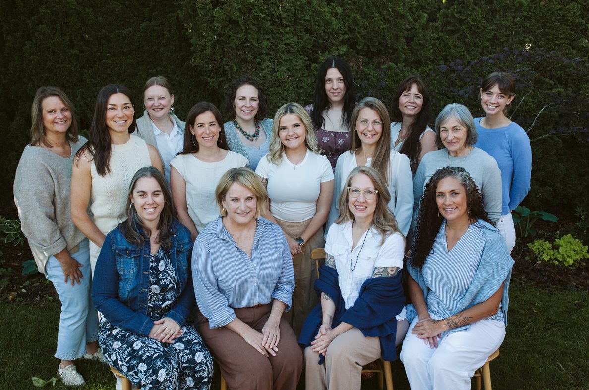 The Quilted Midwives team photographed together outdoors